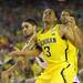 Michigan sophomore Trey Burke has the ball knocked loose by Louisville senior Peyton Siva during the second half of the national championship game at the Georgia Dome in Atlanta on Monday, April 8, 2013. Melanie Maxwell I AnnArbor.com